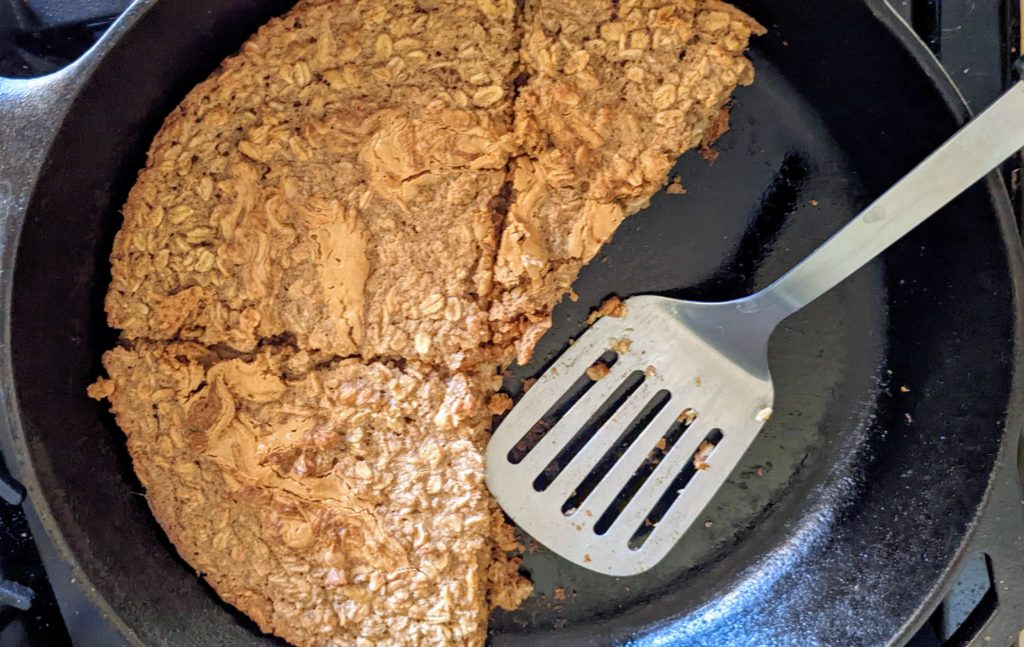 vegan baked oatmeal in cast iron pan